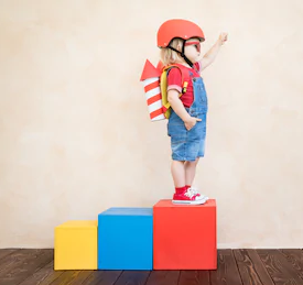 Boy standing on building blocks